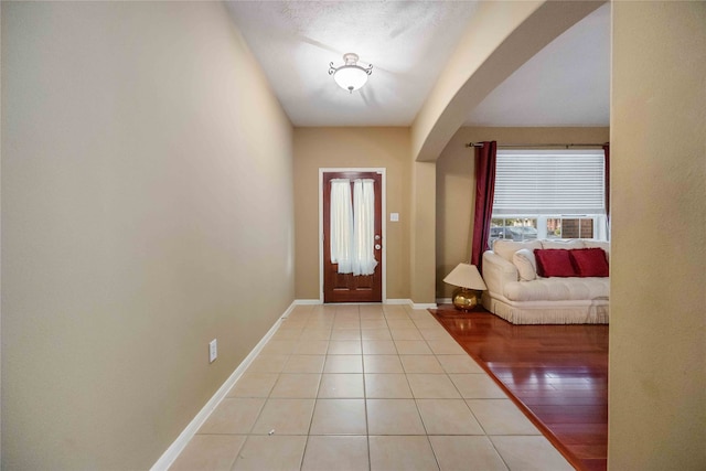 foyer entrance with light hardwood / wood-style flooring