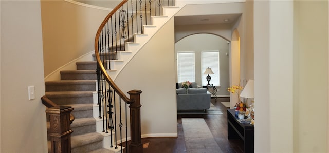 stairs featuring wood-type flooring