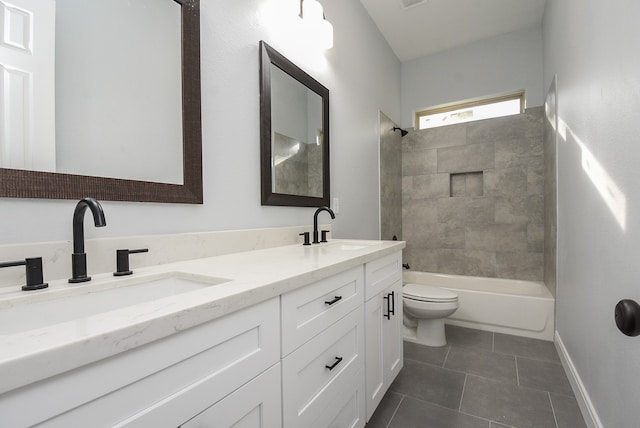 full bathroom with tiled shower / bath, vanity, toilet, and tile patterned floors