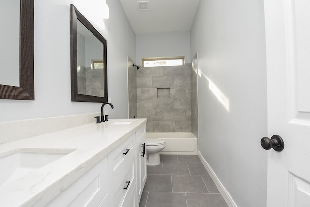 full bathroom with toilet, tiled shower / bath combo, vanity, and tile patterned flooring