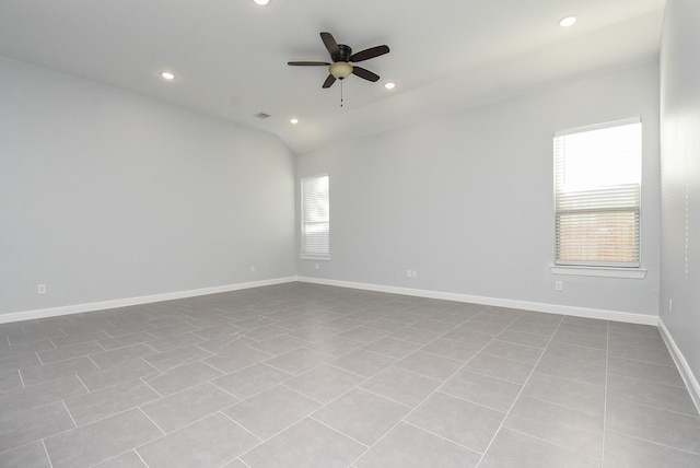 tiled empty room with baseboards, recessed lighting, a ceiling fan, and lofted ceiling