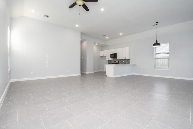 unfurnished living room featuring recessed lighting, light tile patterned flooring, ceiling fan, and visible vents