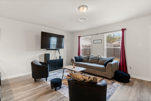 living room with light hardwood / wood-style floors