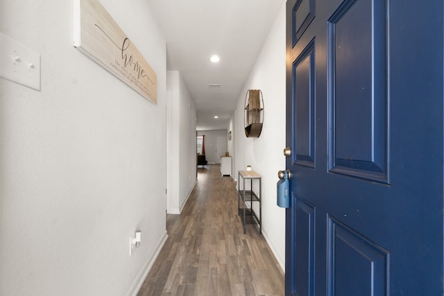 hallway featuring dark hardwood / wood-style floors