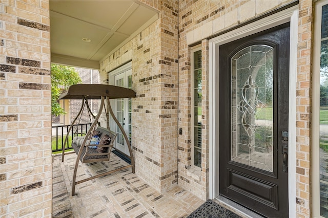 doorway to property with a porch