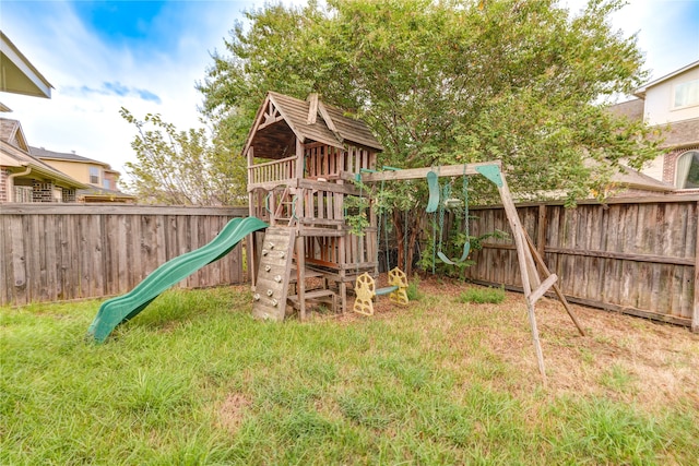 view of jungle gym featuring a lawn