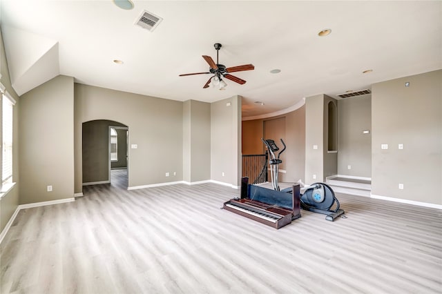 exercise area with light wood-type flooring and ceiling fan