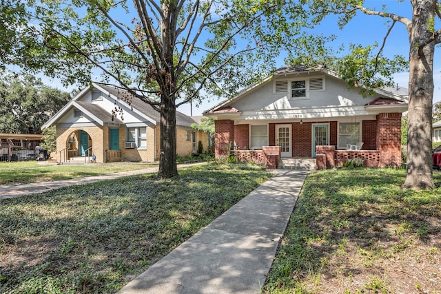 view of front of house featuring cooling unit, a porch, and a front yard