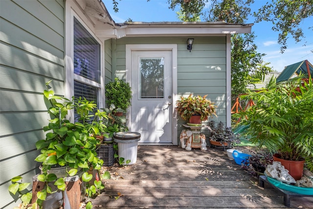 entrance to property with a deck