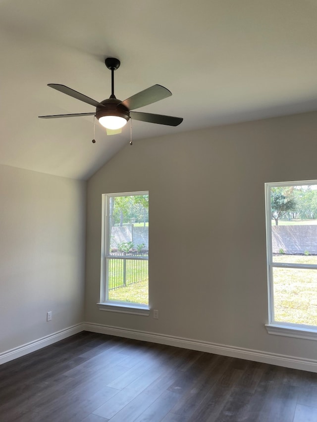 spare room featuring dark hardwood / wood-style floors, ceiling fan, and lofted ceiling