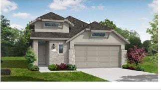 view of front facade featuring a front lawn and a garage