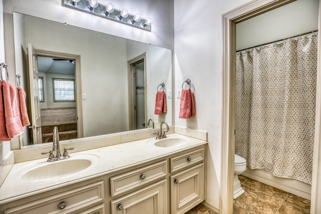 full bathroom featuring toilet, vanity, and shower / bath combo