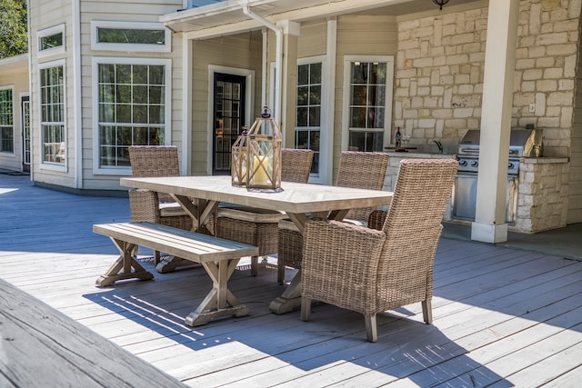 wooden deck with exterior kitchen and grilling area