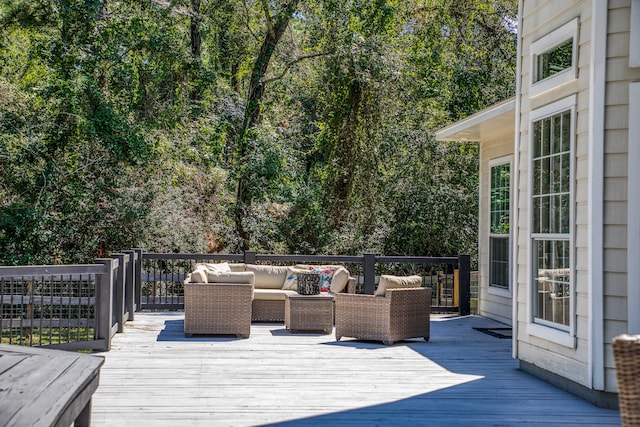 wooden terrace featuring outdoor lounge area