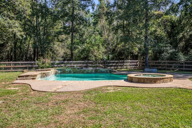 view of pool with a lawn and an in ground hot tub