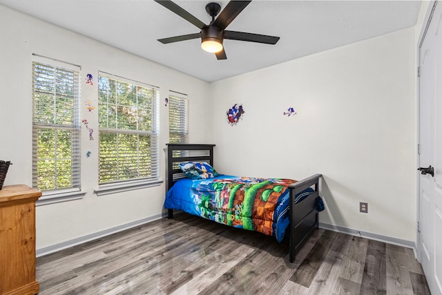 bedroom featuring ceiling fan and hardwood / wood-style flooring