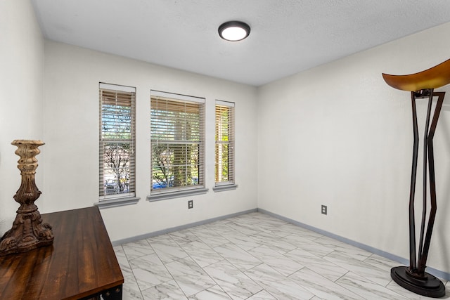 interior space with a textured ceiling