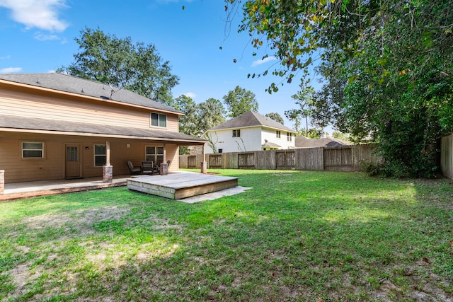 view of yard featuring a wooden deck