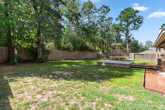 view of yard featuring a wooden deck