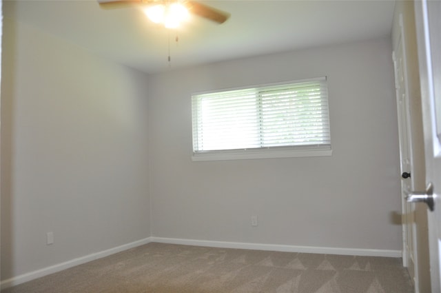 empty room with ceiling fan and light colored carpet