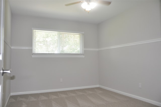 unfurnished room featuring ceiling fan and light colored carpet