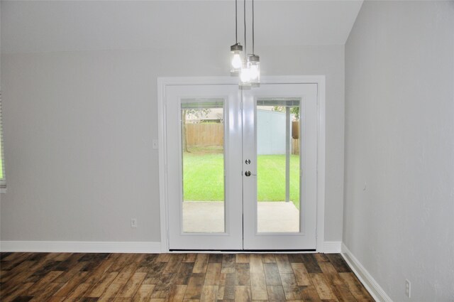 doorway with a chandelier, french doors, and dark hardwood / wood-style flooring