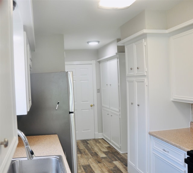 kitchen featuring sink, dark wood-type flooring, and white cabinets