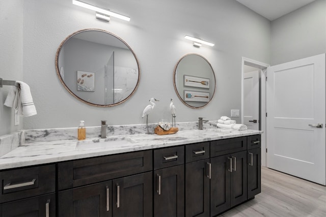 bathroom featuring vanity and hardwood / wood-style flooring