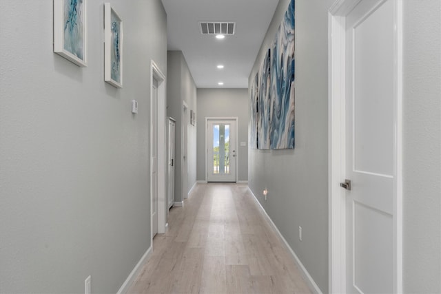 hall with light hardwood / wood-style flooring