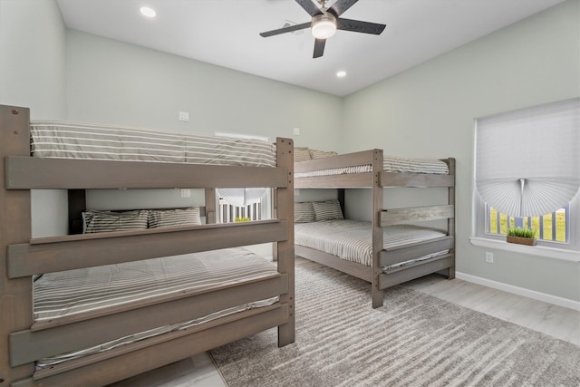 bedroom featuring light wood-type flooring and ceiling fan