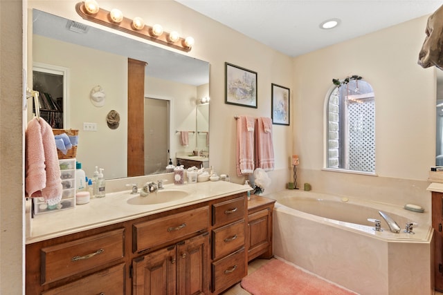 bathroom featuring a bathing tub and vanity