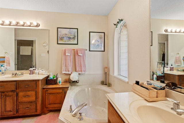 bathroom with vanity and plus walk in shower