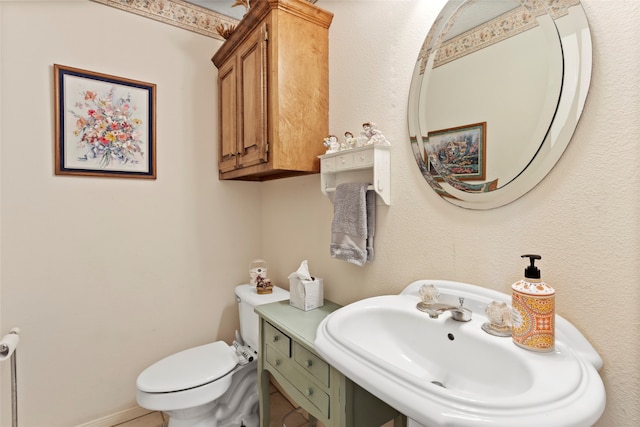 bathroom with sink and toilet