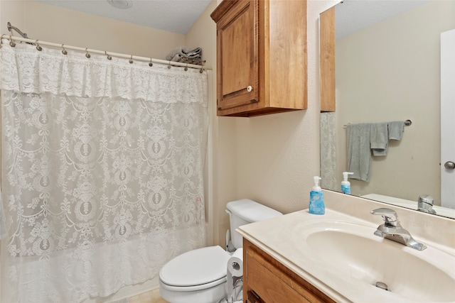 full bathroom with shower / bath combo, a textured ceiling, vanity, and toilet