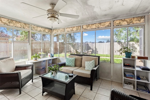 sunroom with ceiling fan and plenty of natural light