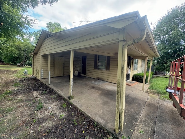 view of property exterior with a carport