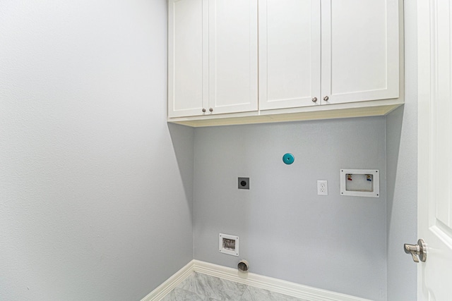 clothes washing area with hookup for an electric dryer, hookup for a washing machine, and cabinets