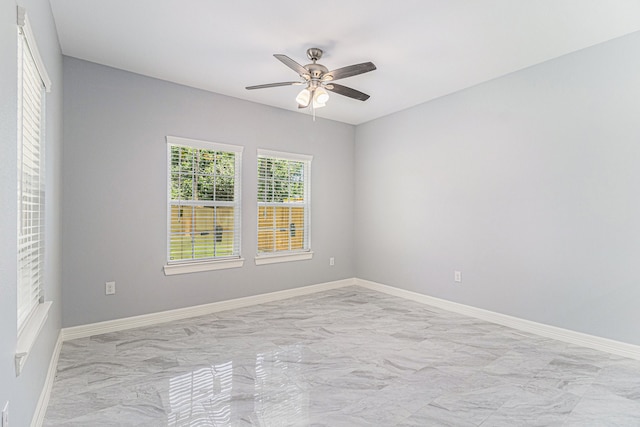 unfurnished room featuring ceiling fan