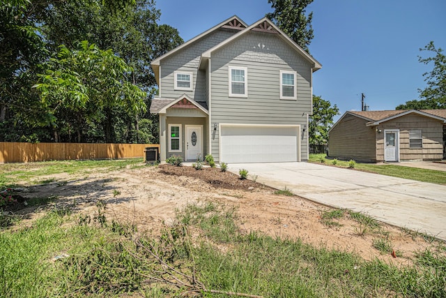 craftsman-style home featuring a garage and cooling unit