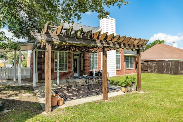 back of property with a pergola, a patio, and a lawn