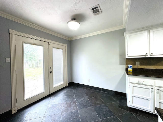 doorway to outside featuring french doors, a textured ceiling, and crown molding