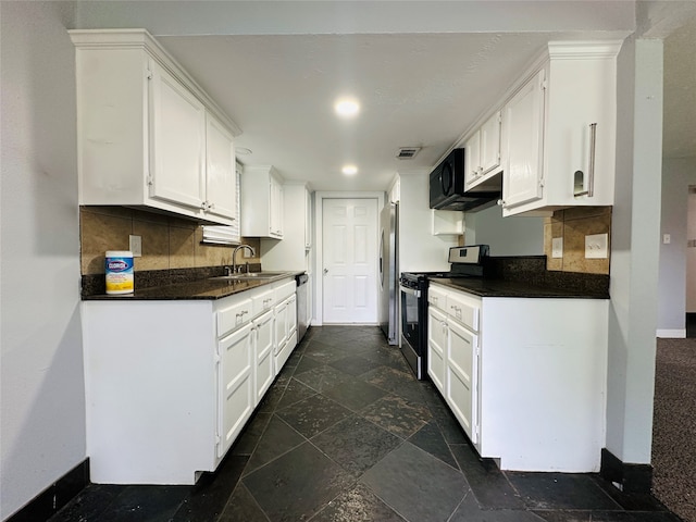 kitchen with stainless steel appliances, backsplash, sink, and white cabinetry