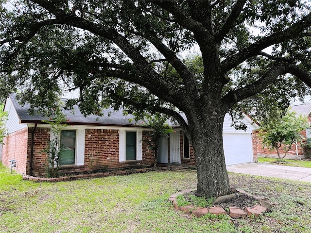 ranch-style house with a front yard and a garage