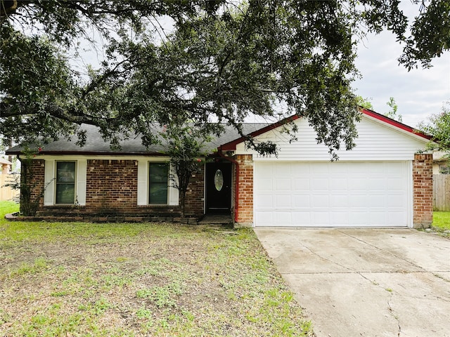 ranch-style house featuring a garage