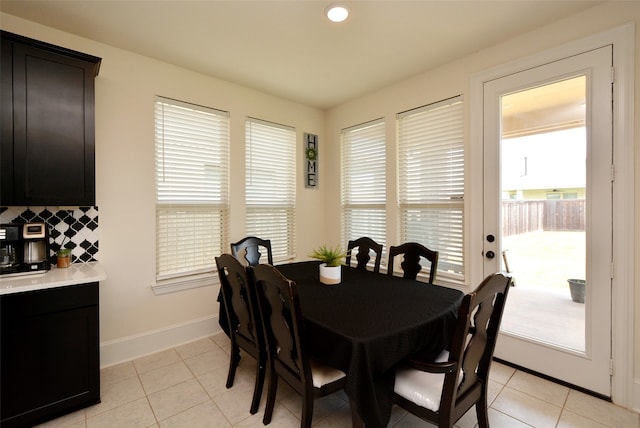 dining area featuring light tile patterned floors