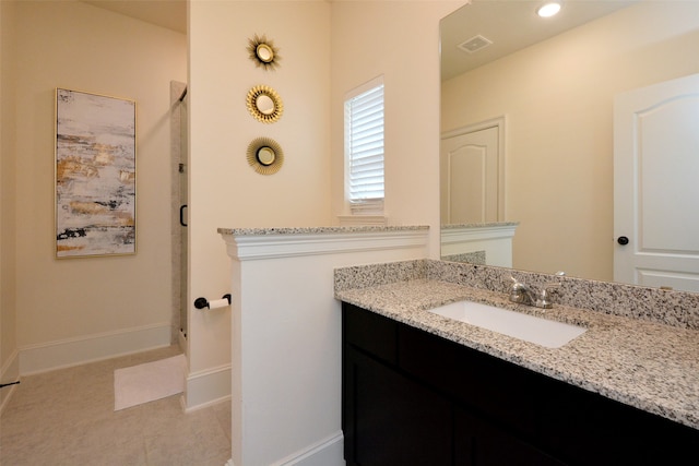 bathroom featuring tile patterned floors and vanity