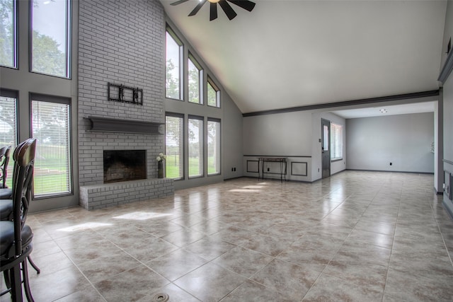 unfurnished living room featuring a fireplace, light tile patterned floors, high vaulted ceiling, and ceiling fan