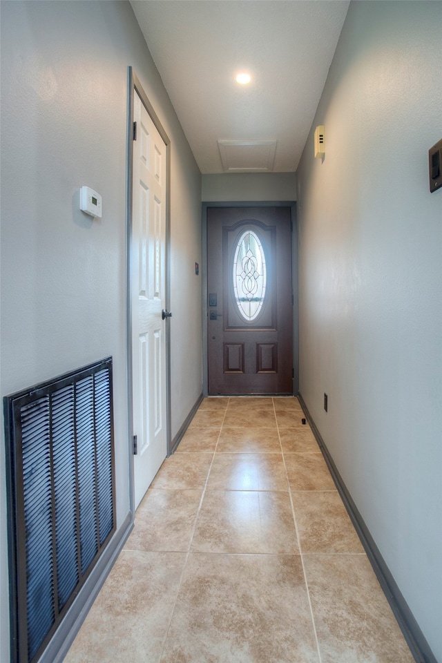 entryway featuring light tile patterned floors