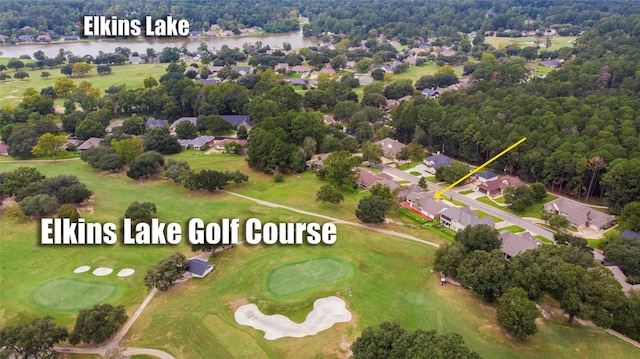 aerial view featuring view of golf course and a water view