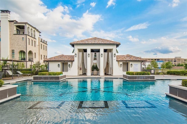 view of swimming pool with a patio